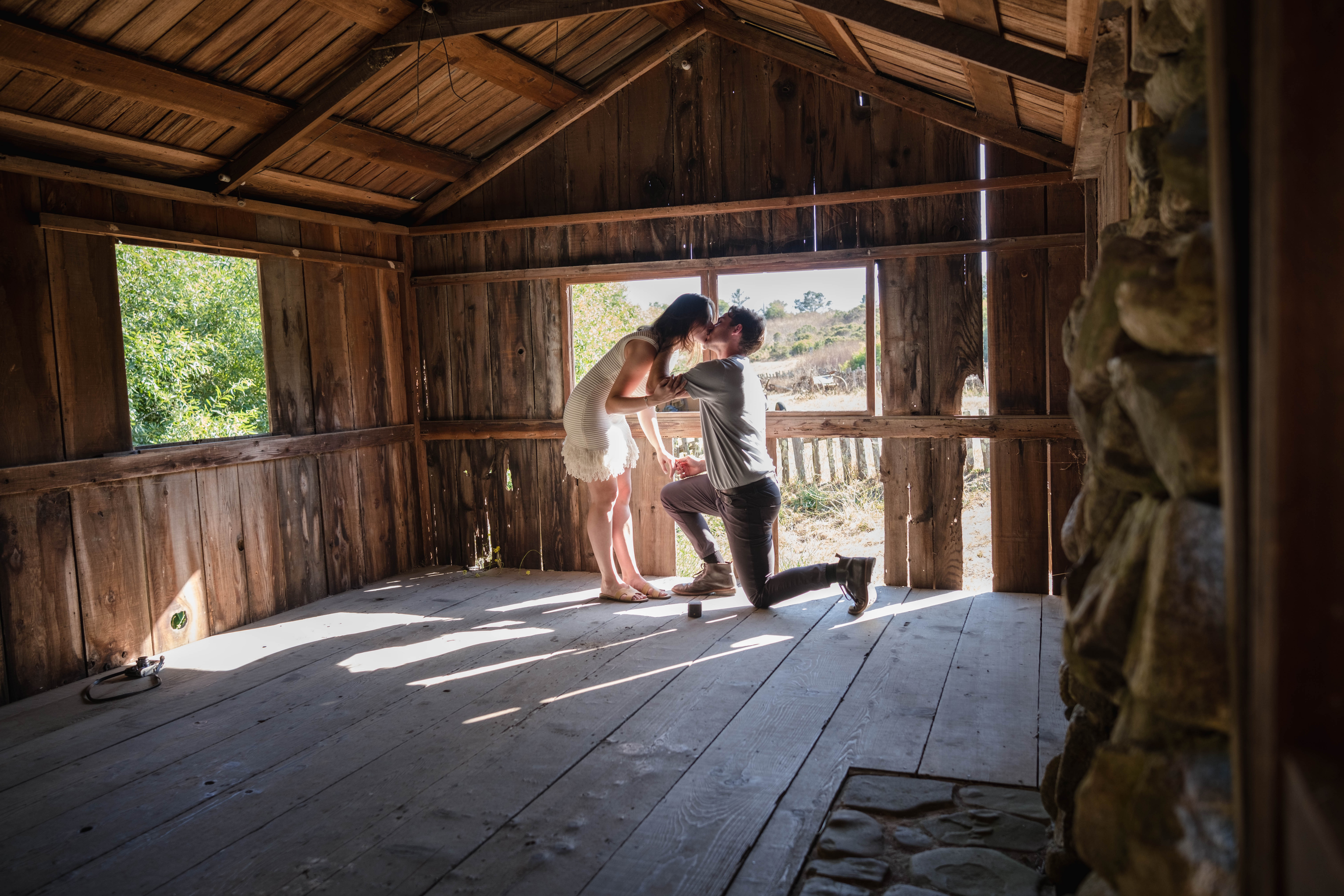 Proposal moment inside rustic barn