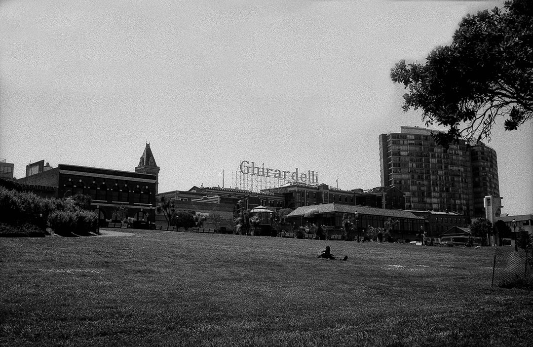 Ghirardelli Square with person on grass