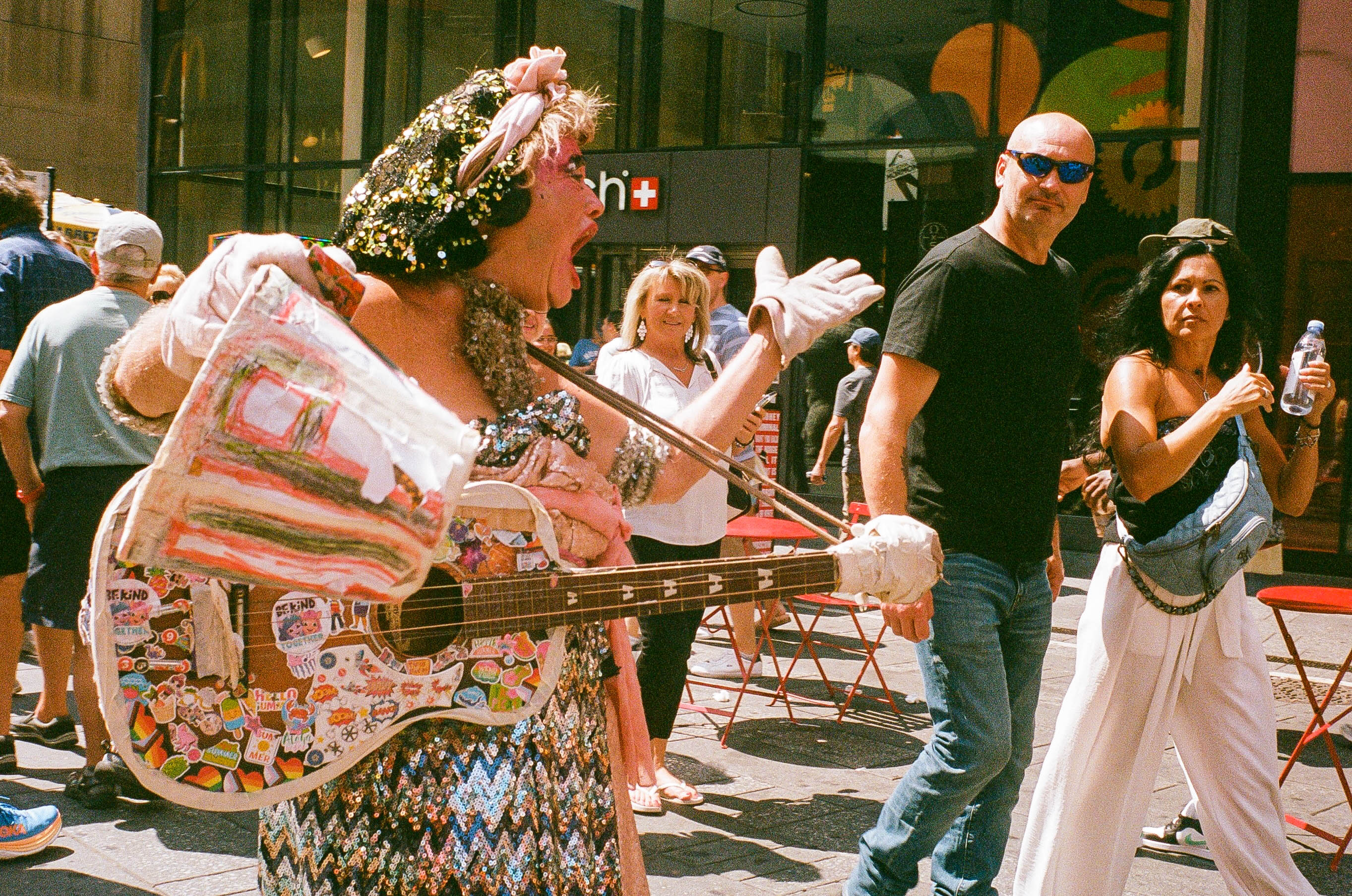 Colorful street performer with guitar