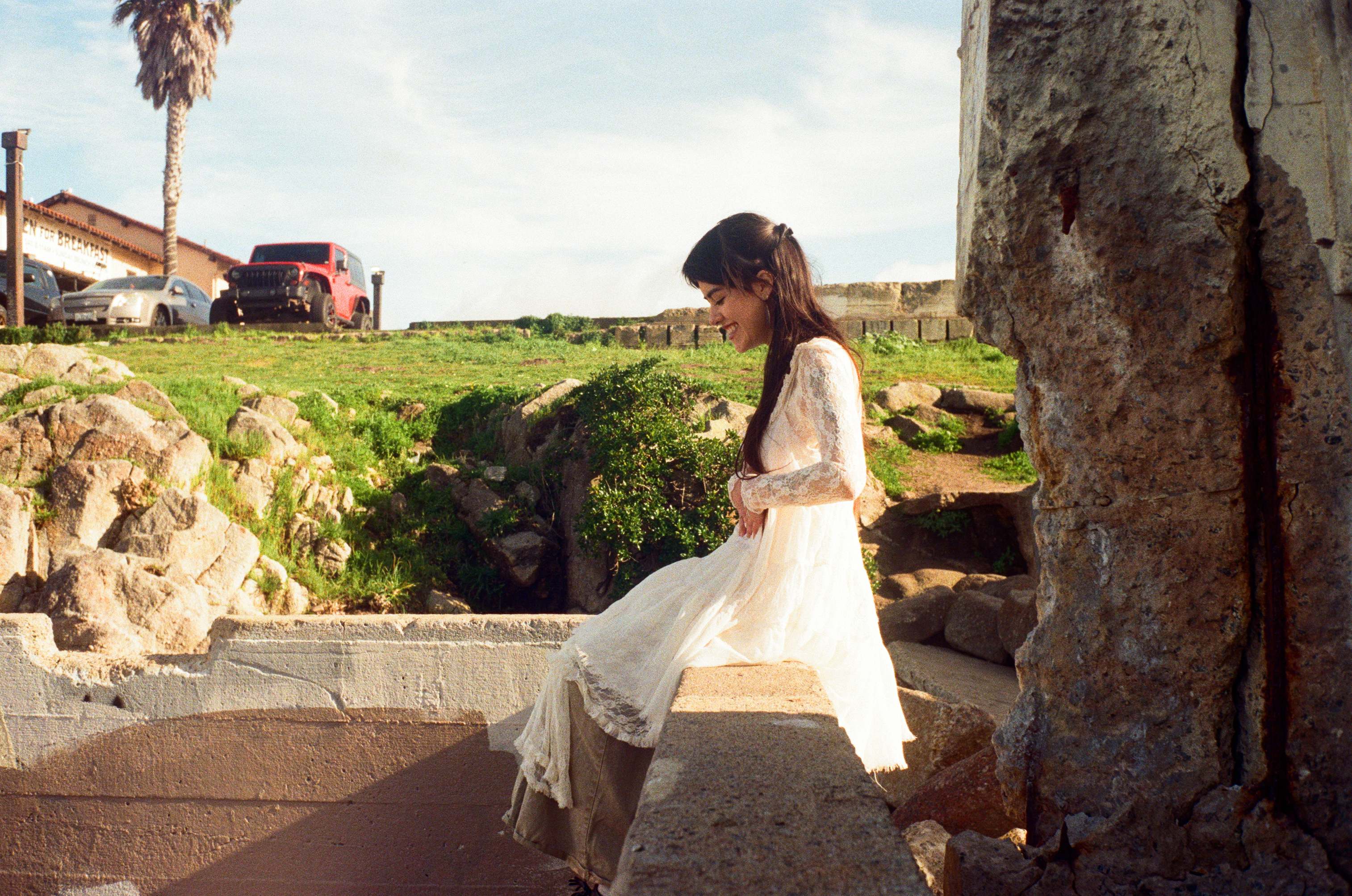 Woman in white dress at historic ruins